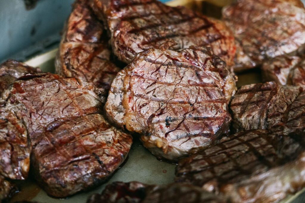 Deliciously grilled ribeye steaks with perfect grill marks, ready to be served for dinner.